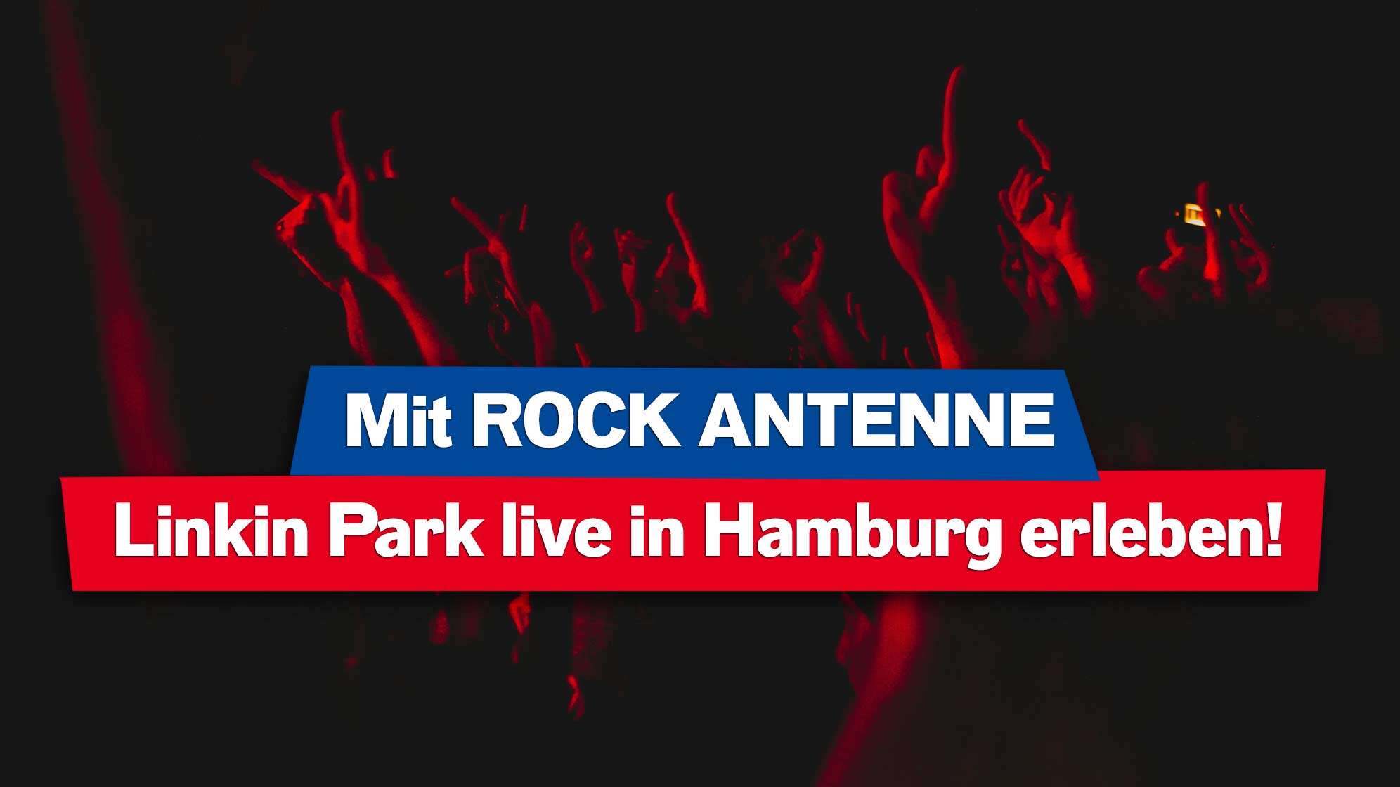 Foto von Konzert Crowd in rotem Licht mit hochgereckten Händen, dazu der Text: Mit ROCK ANTENNE Linkin Park live in Hamburg erleben